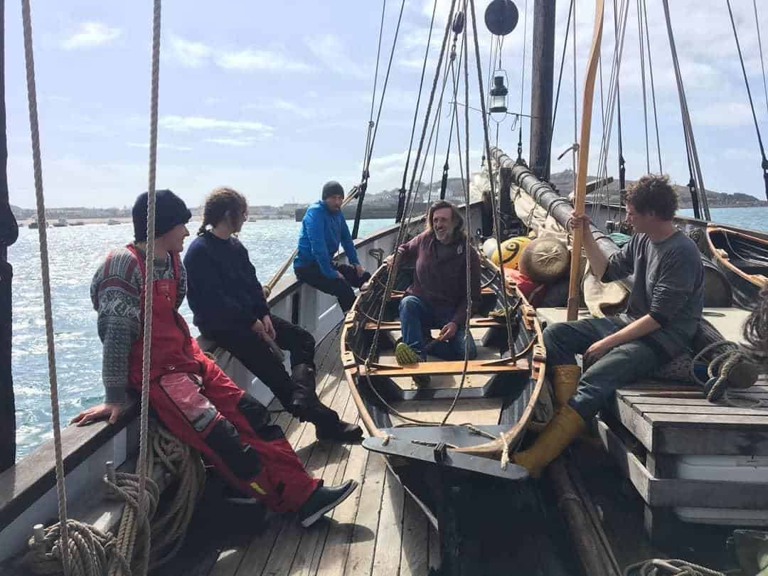 Grayhound crew get ready to take a cargo ashore by ships boats Grayhound crew get ready to take a cargo ashore by ships boats