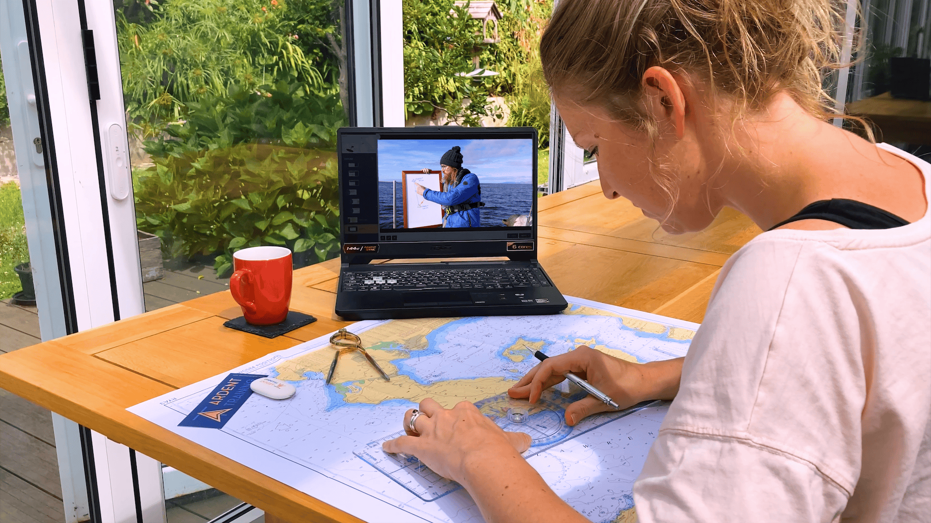 Student studying chartwork with an online course through Classic Sailing partners Ardent Training